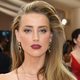 Illustration for article titled Amber Heard Says She Will Not Settle Her Domestic Violence Case